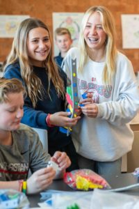 Two SFC Middle School students build a DNA model in science class.